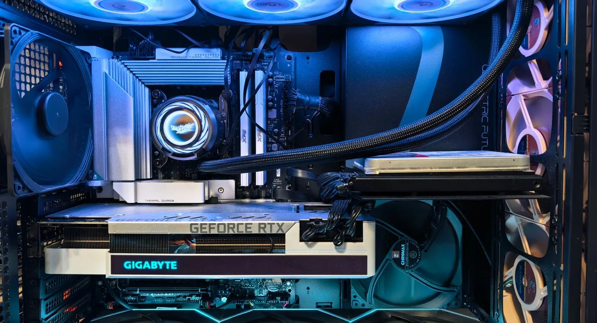 Close-up of an advanced gaming desktop PC with GeForce RTX, liquid cooling, and RGB lighting.