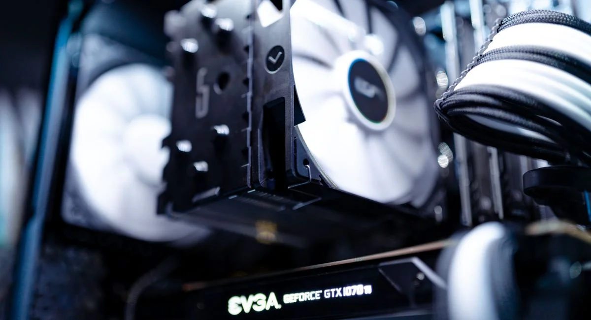 Detailed view of a cooling fan inside a modern gaming PC setup.